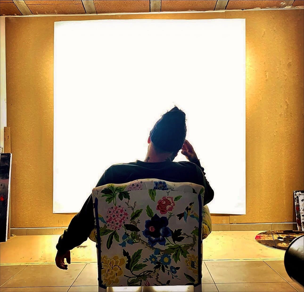 In the studio before a blank canvas